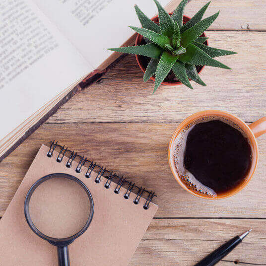 Image of notebook and cup of coffee